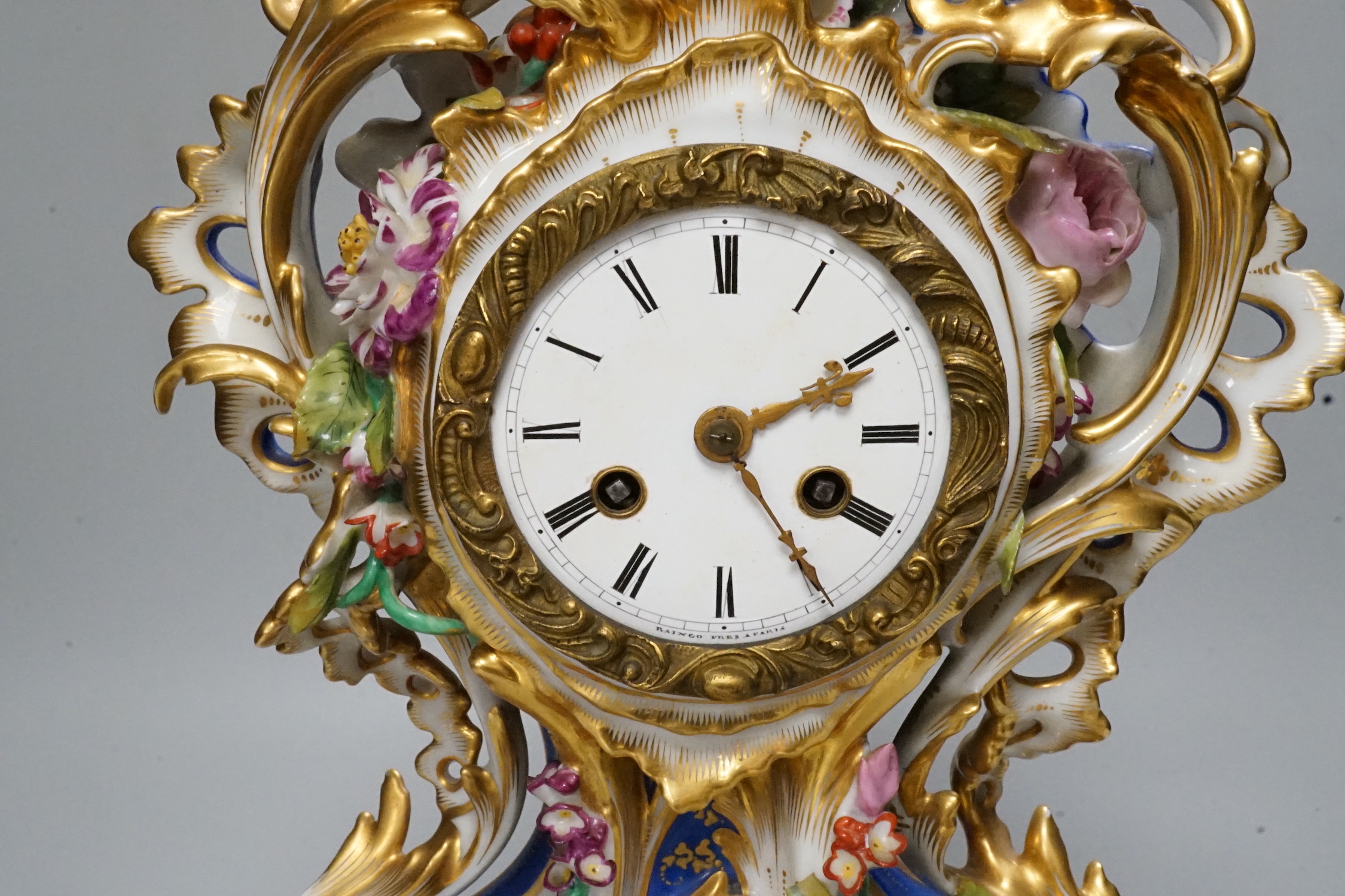 A mid 19th century French porcelain mantel clock and stand, probably Jacob Petit, 43cm tall